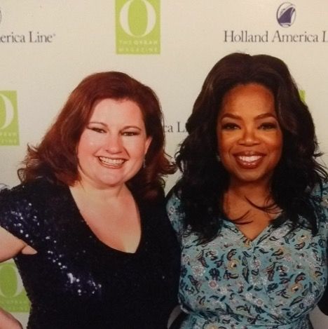 Kristy Grant-Hart and Oprah Winfrey smiling